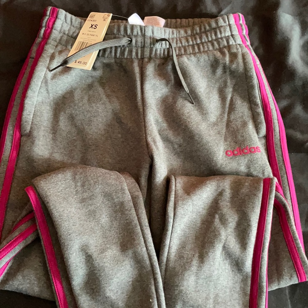Gray Adidas sweatpants with pink stripe